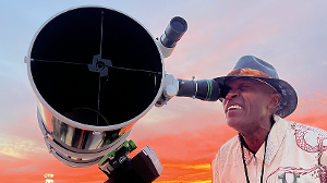 Guest Benard Udeozor, of Benard C. Udeozor & Associates, explores the solar telescope during sunset on the rooftop of the SMC Math + Science Building. [Photo Credit: Martin Cohen Photography]