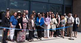 Invitees cutting the ribbon