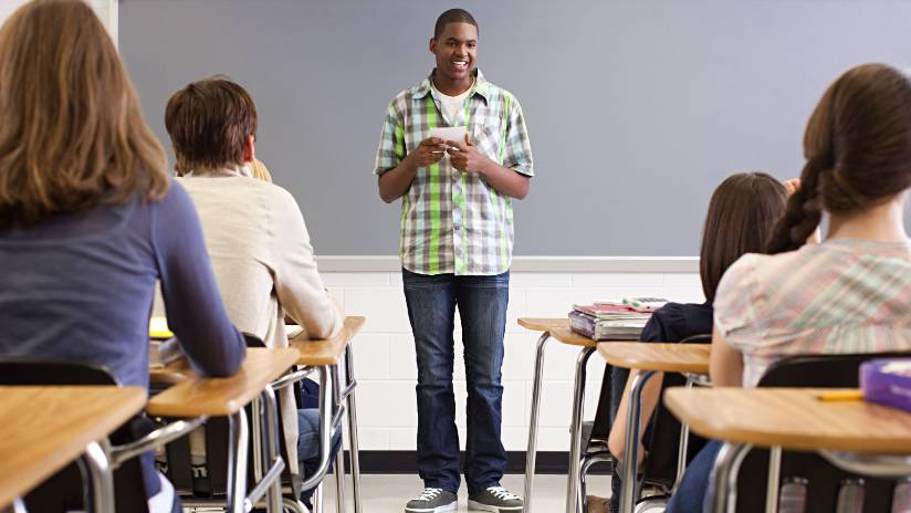 student speaking to class