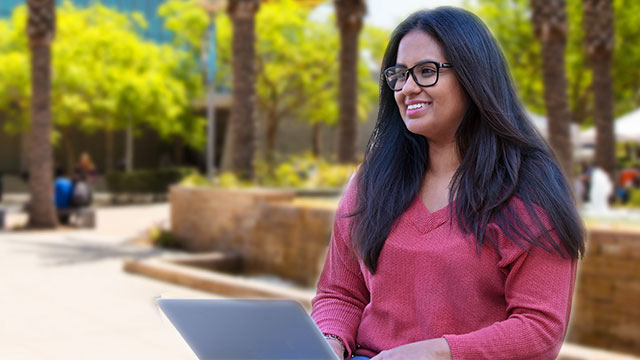 Student on computer at campus