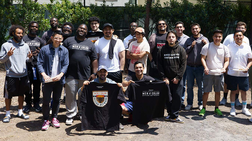 Men of Color Action Network students, staff and faculty gathered at a BBQ.
