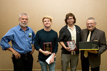 SMC photojournalism professor and Corsair co-adviser holding awards