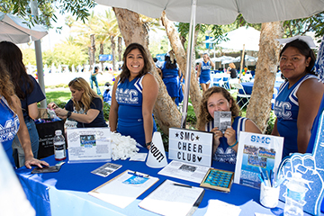 SMC cheerleaders at a “mini club row”