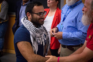 Hesham Jarmakani shaking hands with Dan Nannini