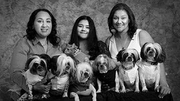 Perla Garcia, her niece, sister and their six dogs and cat 