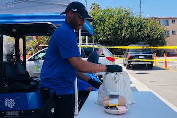 Derrick Davis leaves out bags of groceries and meals