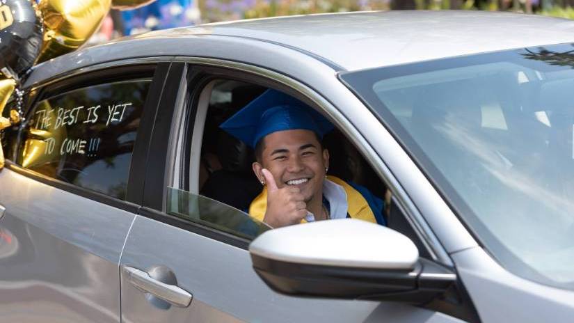 Grad Walk Thumbs Up