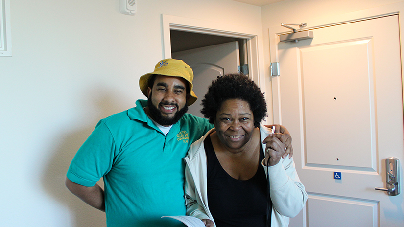 LAHSA Outreach member Malik with his client Felicia after moving her into her permanent home.