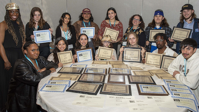 The Spring 2025 staff of Santa Monica College’s student-run media outlet The Corsair with their awards at the 2025 National College Media Conference, organized by the Associated Collegiate Press and the Journalism Association of Community Colleges. (Photo Credit: Gerard Burkhart) 
