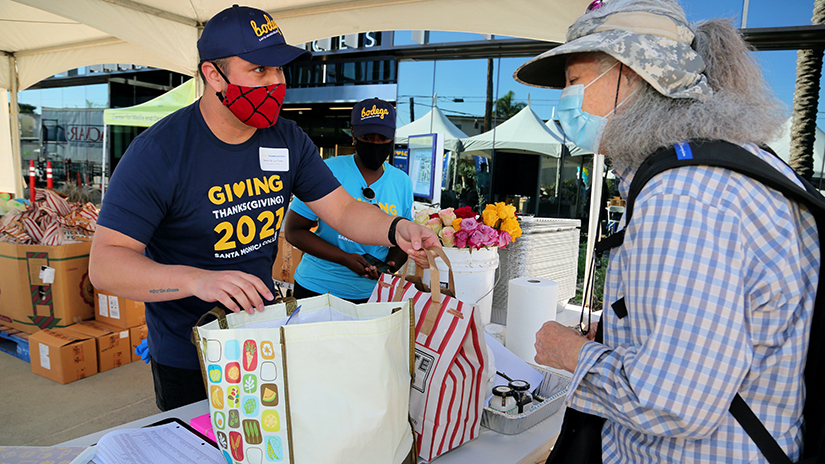 An SMC Volunteer Handing Out Goodies