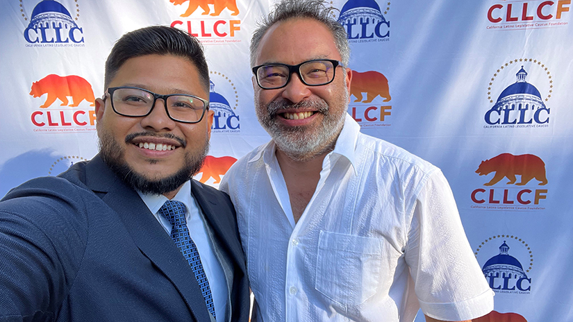 Alejandro Lee with student Brandon Sanchez at scholarship ceremony