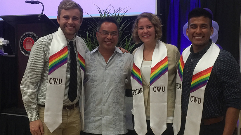 Lee with students at Pride graduation