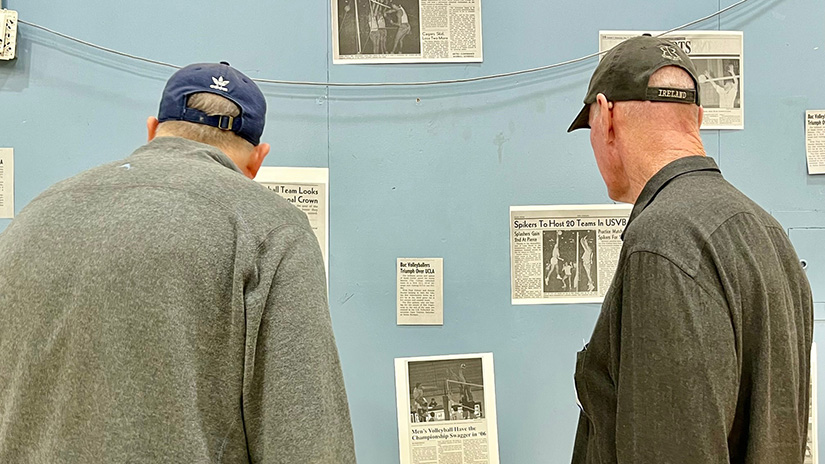 Alum looking at old news clippings
