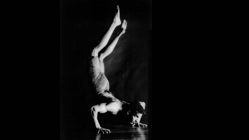 Mark Tomasic performing a handstand. Tomasic has a BFA in ballet.