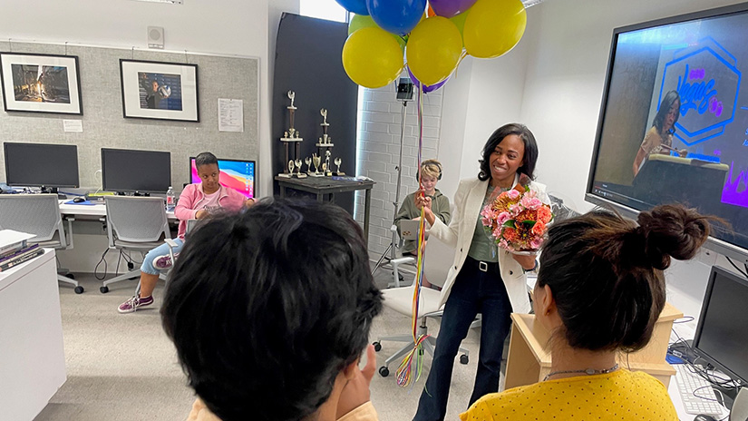 Ashanti Blaize being congratulated by Corsair staff