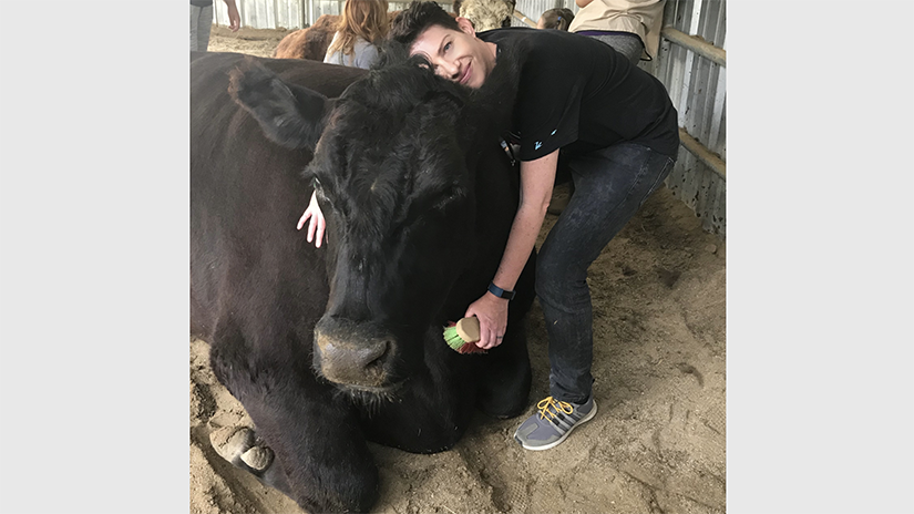 Sara Brewer with bovine friend