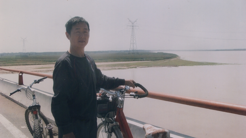 Jing's dad on their 400 mile bike trip