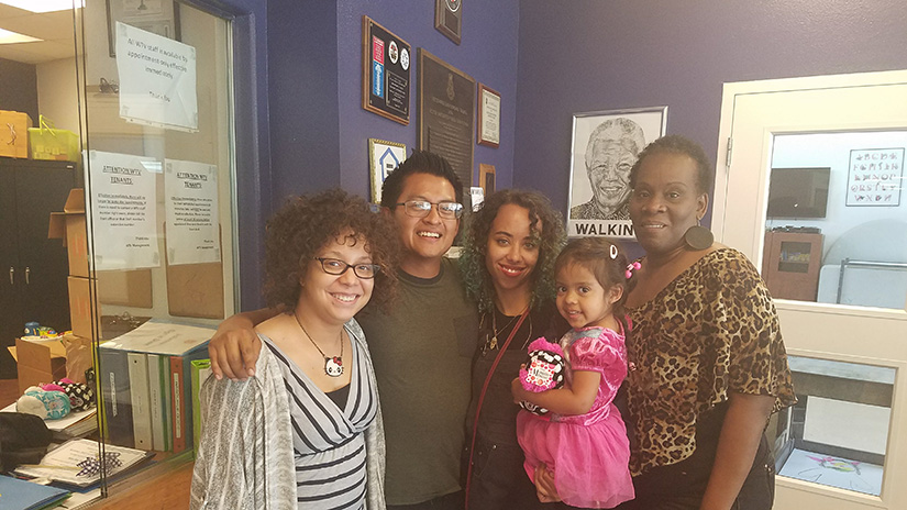 The Renoj family with Salvation Army staff