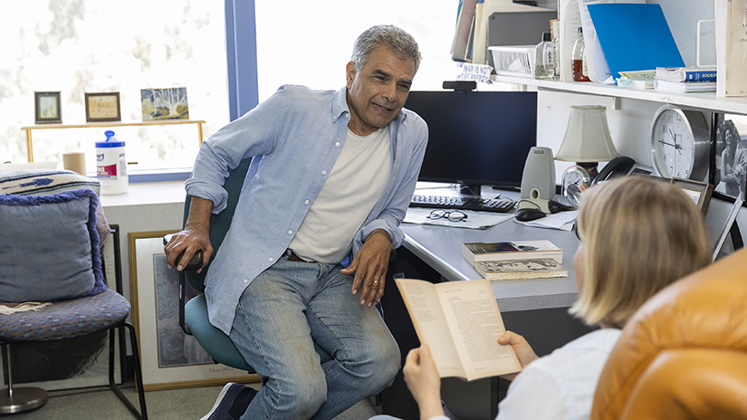 Mario Padilla talking with a student