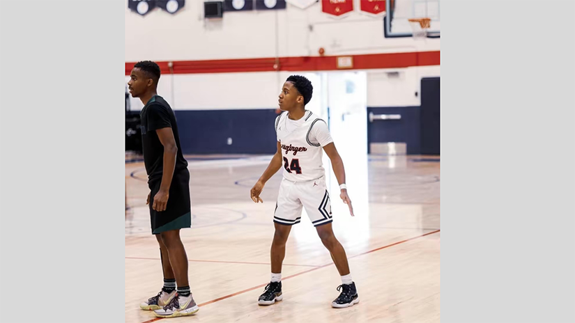 Dexter playing basketball at Leuzinger High