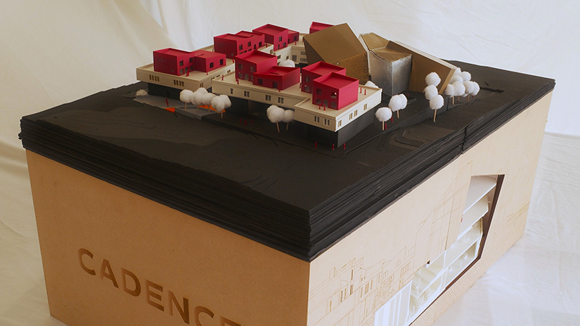 Aerial view highlighting the site model's laser-cut topography and 3D-printed buildings atop the MDF base.
