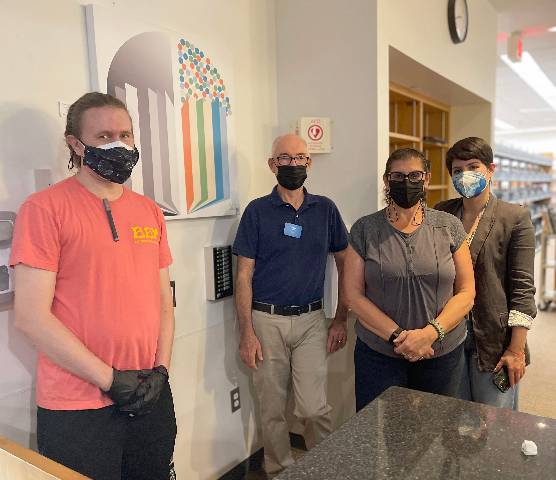 Justin C.M. Brown with SMC library staff