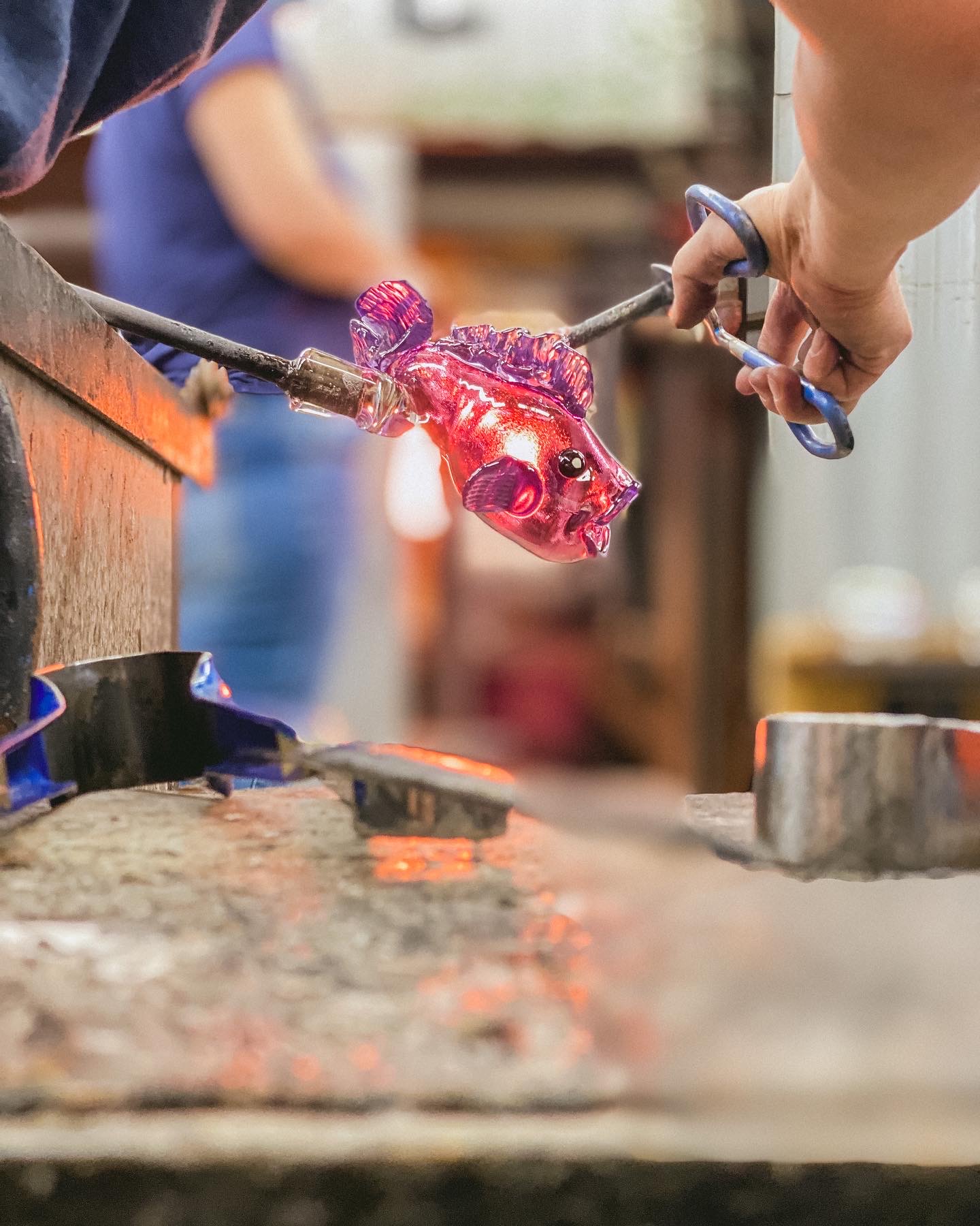 Purple glass being heated and manipulated