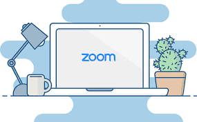 Laptop on desk, Zoom logo on laptop screen